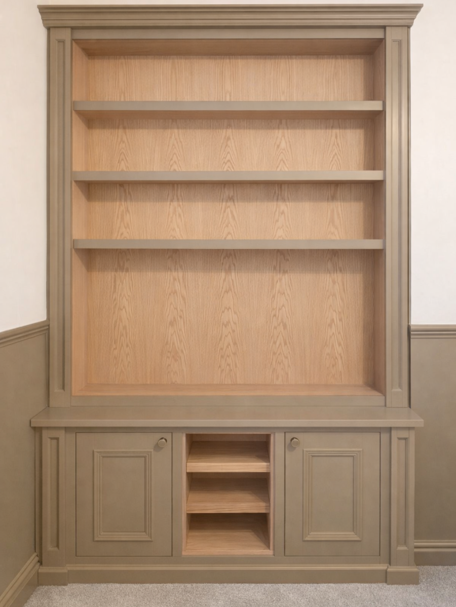 Bespoke fitted alcove cabinetry with shelving either side of a chimney breast